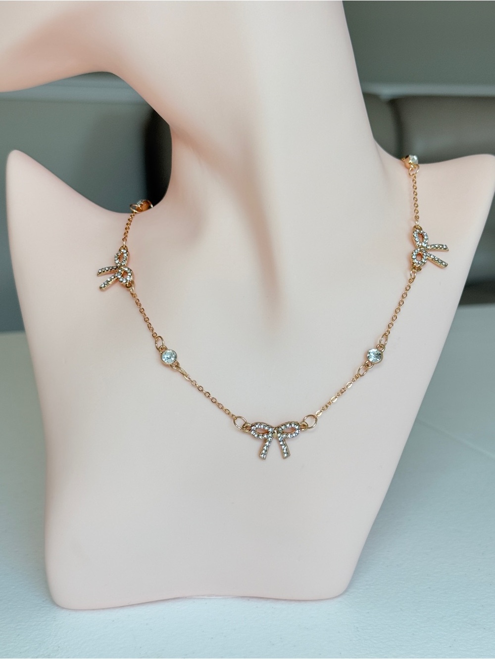 Gold Bow Pendant Necklace with Crystal Accents - Women's Jewelry
